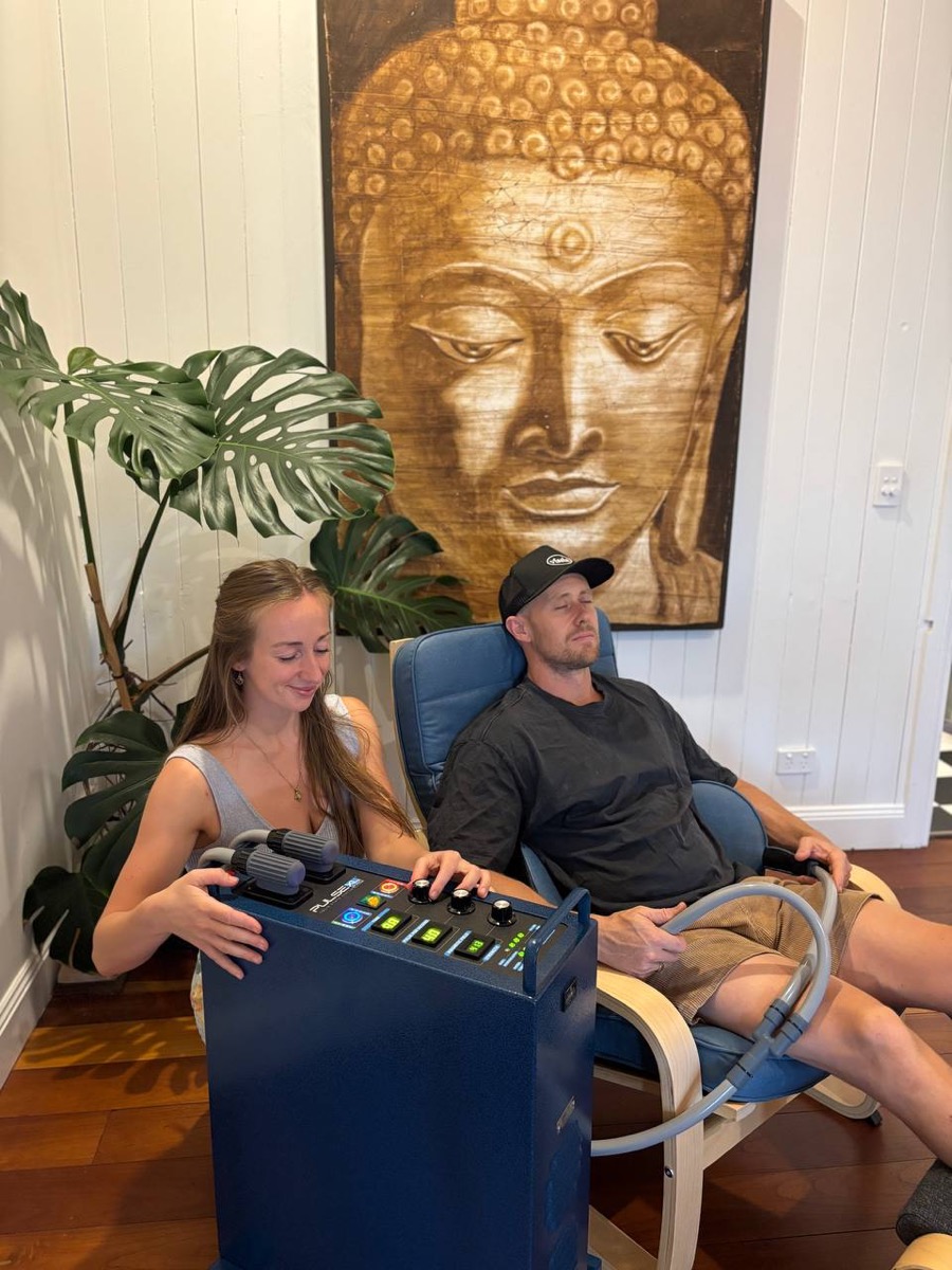Becky Murray operating the PEMF unit at Soul Song Temple